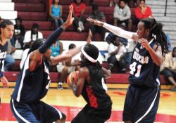 The Hoyas defense tries to slow down the Boys Dem spark plug, Kadeem Jones.